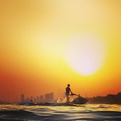 Silhouette of woman at sunset