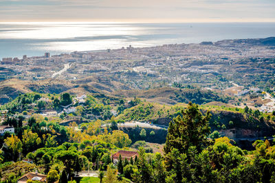 High angle view of townscape against mediterranean sea at fuengirola