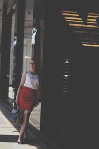 Woman standing on staircase