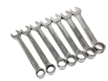 High angle view of spanners on white background
