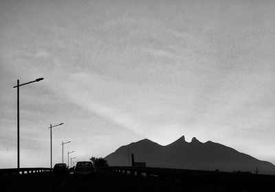 View of road against cloudy sky