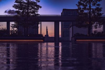 Reflection of building in lake at sunset