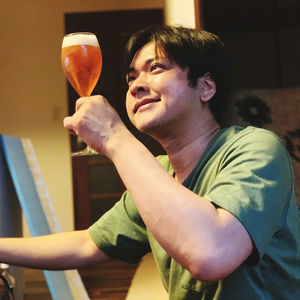 Portrait of a smiling young woman sitting at home