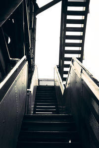 Low angle view of staircase in building against sky