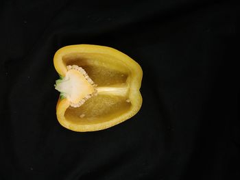 High angle view of yellow fruit against black background