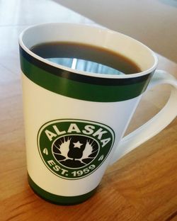 High angle view of coffee cup on table