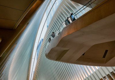 High angle view of people walking on escalator