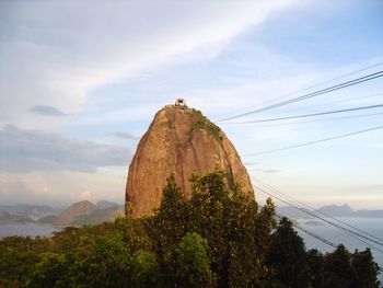 Scenic view of mountains against cloudy sky