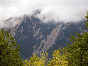 Scenic view of mountains against sky during foggy weather