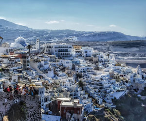 High angle view of city against cloudy sky