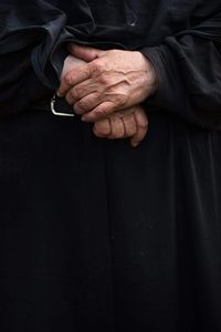 Close-up of human hand against black background