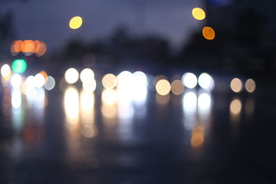 Defocused image of illuminated lights at night