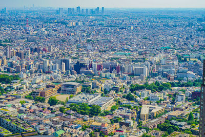 High angle view of modern buildings in city against sky