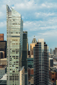 Modern buildings in city against sky