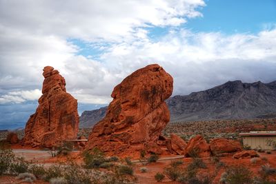 Rock formations on landscape against sky