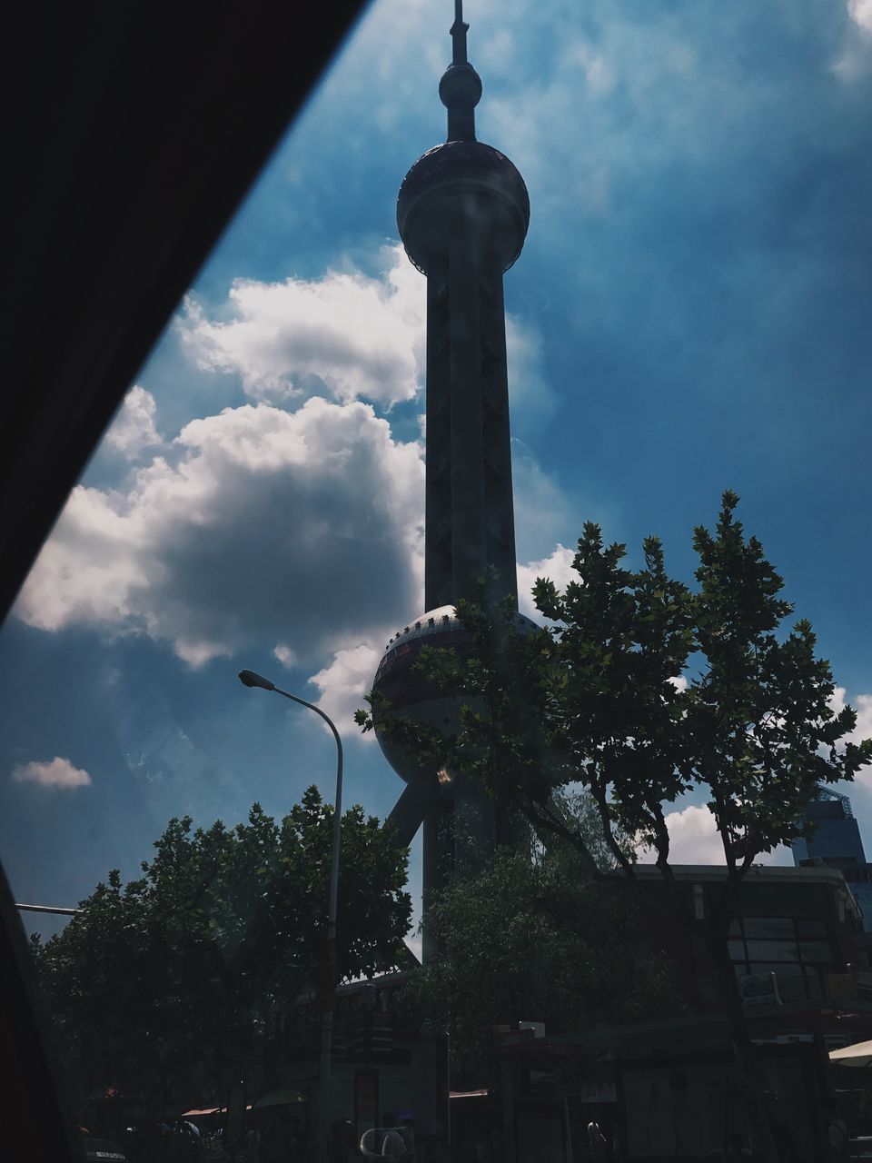 LOW ANGLE VIEW OF STREET LIGHT AGAINST BUILDING