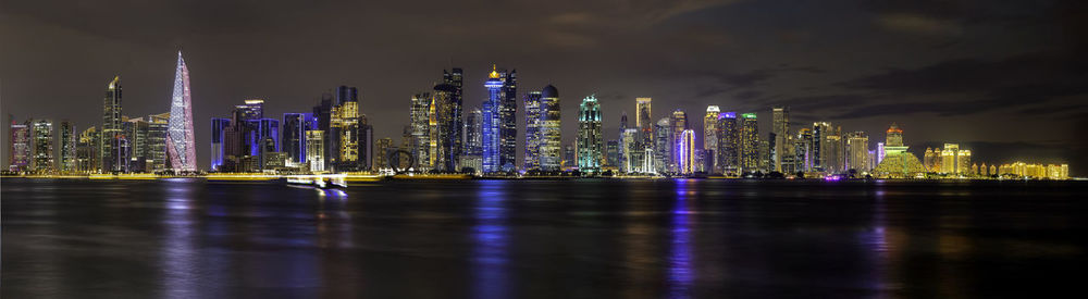 Illuminated buildings in city at night