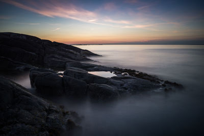 Scenic view of sea against sky during sunset