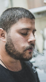 Close-up of young man smoking
