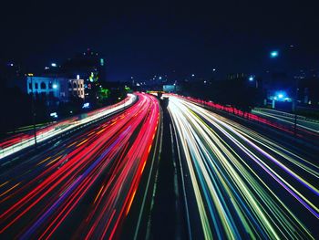 High angle view of light trails on highway at night