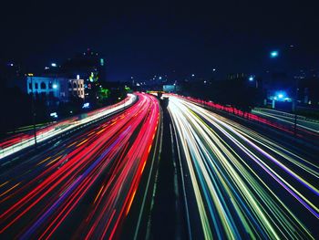 High angle view of light trails on highway at night