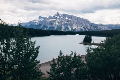 Scenic view of lake and mountains against sky