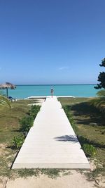 Scenic view of sea against clear blue sky