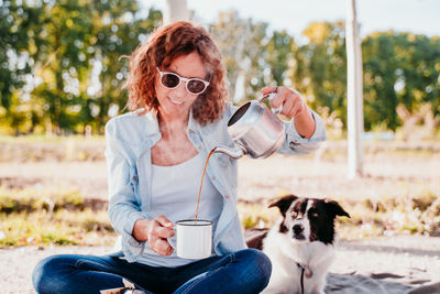 Portrait of a dog drinking water