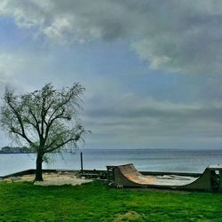 Scenic view of sea against cloudy sky