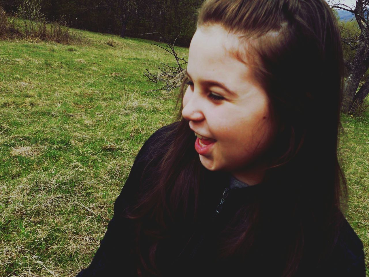 person, young women, lifestyles, long hair, grass, young adult, leisure activity, headshot, portrait, field, looking at camera, brown hair, casual clothing, front view, contemplation, childhood