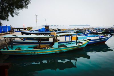 Boats moored in sea