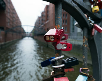 Close-up of padlocks on railing
