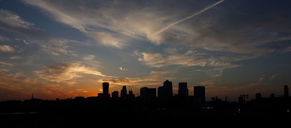 Silhouette of city at sunset