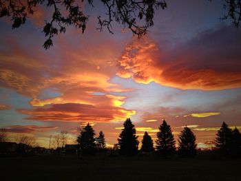 Silhouette of landscape against cloudy sky