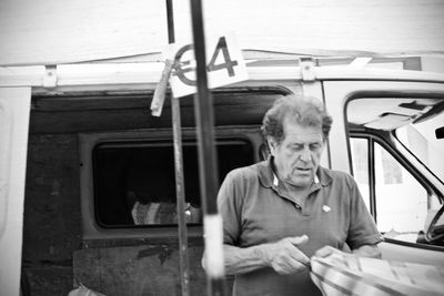 Portrait of man sitting in car