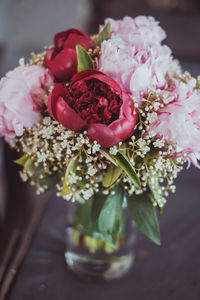 Close-up of flower arrangement with pink peonies in vase