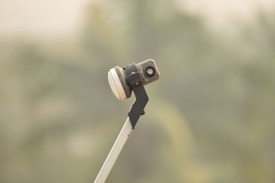 Close-up of coin-operated binoculars against blurred background