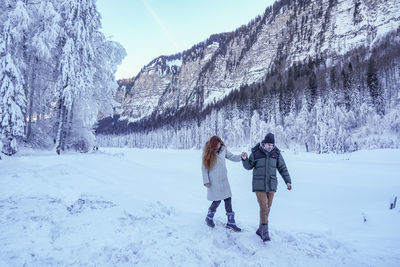 Walking around frozen lake montriond.