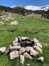 Barbecue zone at the stack of rocks on the mountain against sky