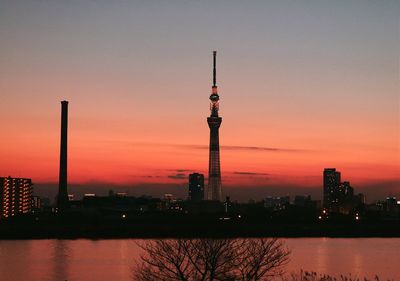 Illuminated city at sunset