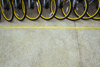 High angle view of bicycles parked on footpath