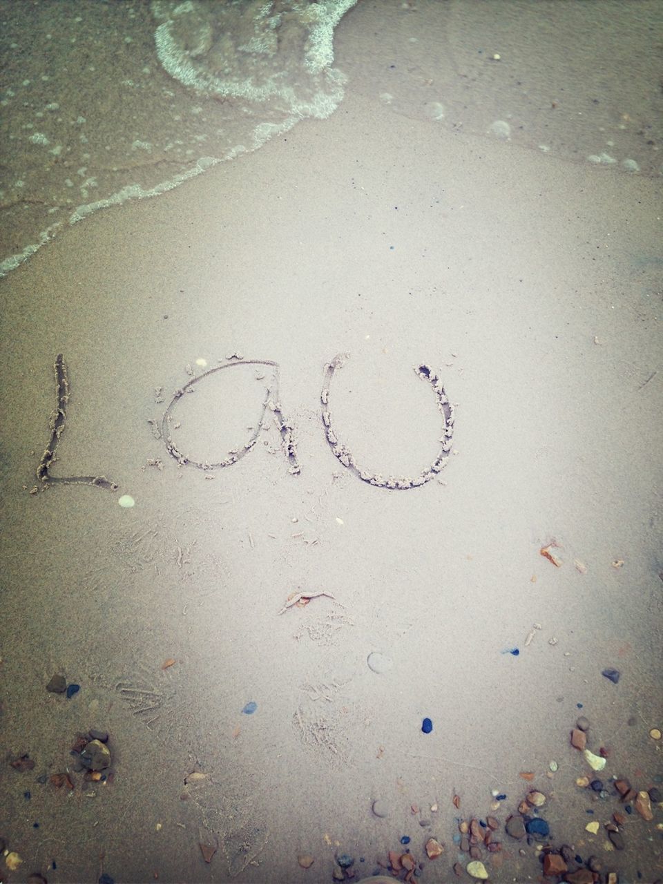 text, water, sand, beach, western script, high angle view, communication, shore, footprint, wet, heart shape, love, close-up, day, outdoors, creativity, no people, capital letter, ideas, nature