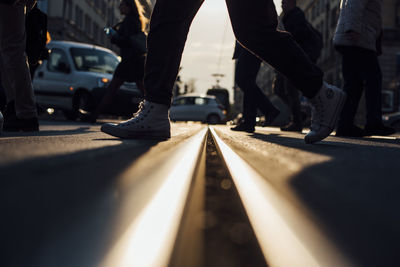 Low section of people walking on railway bridge