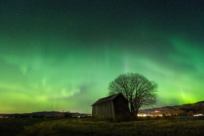 Scenic view of field against sky at night