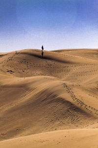 Scenic view of desert against clear sky