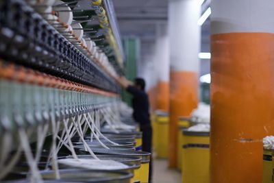 Row of illuminated machine in factory
