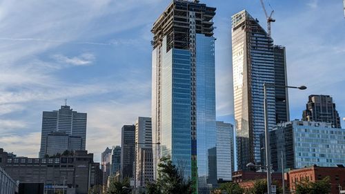 Skyscrapers in city against sky