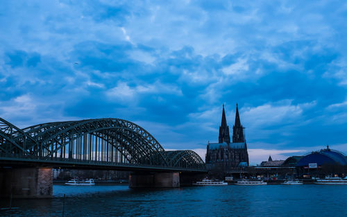 View of bridge over river with city in background