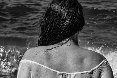 Rear view of woman in water