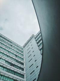 Low angle view of modern buildings against sky